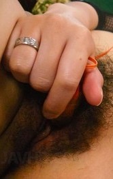 Yuria Kano Asian fucks her hairy cunt with vibrator under fishnet